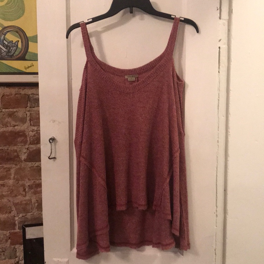 A cut out shoulder, long sleeved top.